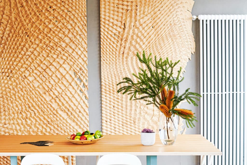 textural wall in dining room of loft